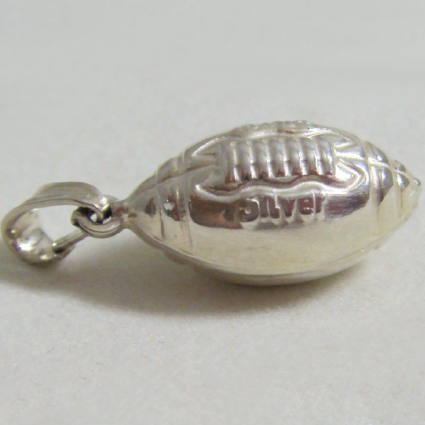 (p1299)Silver pendant in motif Rugby football.